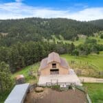Repainted tan barn near Deadwood SD completed by Black Mountain Painting with fresh exterior finish.